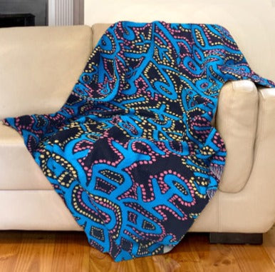 Cotton Throw featuring Pikilyi by Theo Hudson